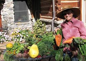 Lyn Kneese with her giant homegrown carrots